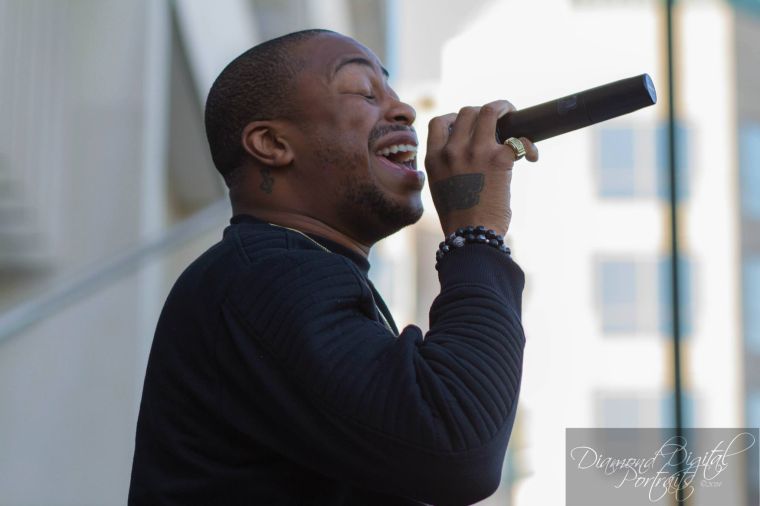 Raheem DeVaughn performs at Dr. Cathy Hughes wax figure unveiling