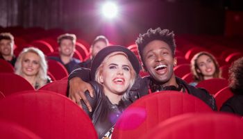 Multi ethnic couple in the movie theater
