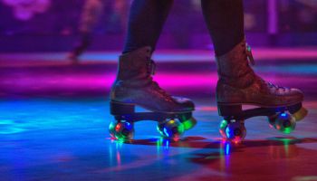 Low Section Of Person Wearing Roller Skates