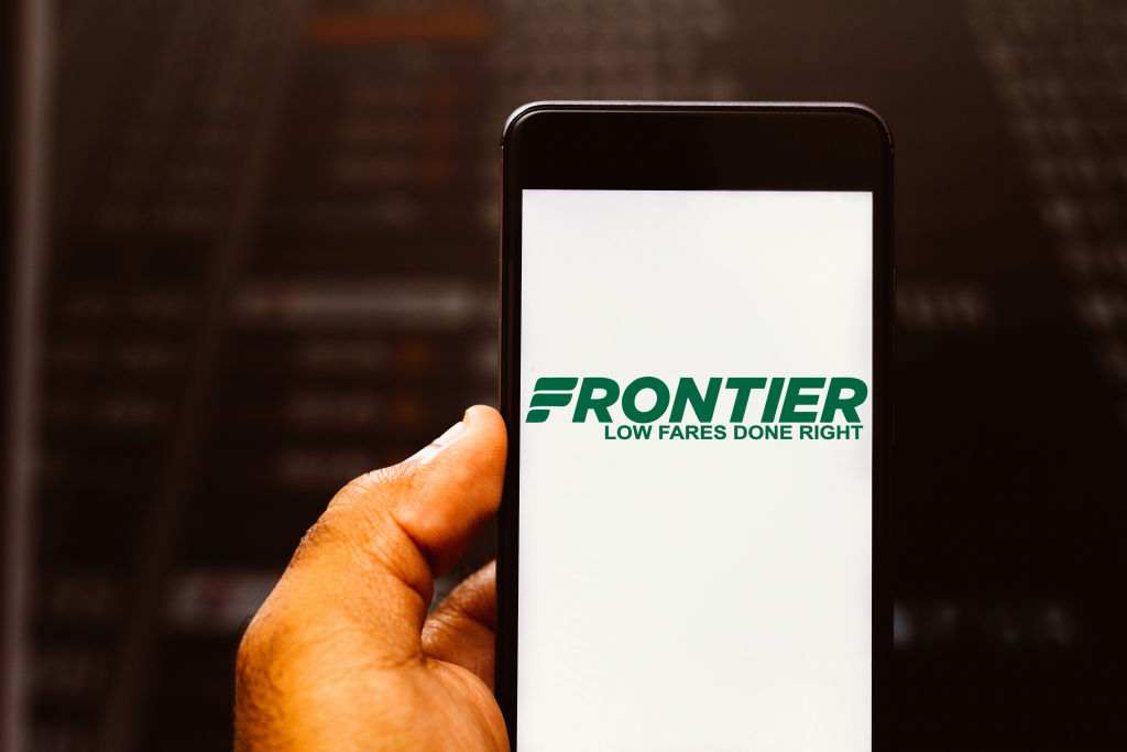 In this photo illustration the Frontier Airlines logo is...