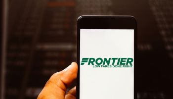 In this photo illustration the Frontier Airlines logo is...