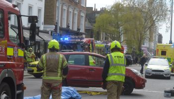 A car flips in an road traffic accident on Kings Road