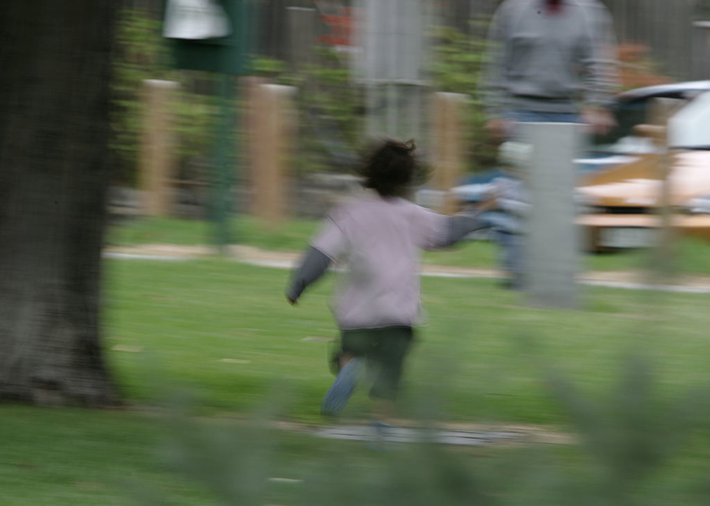 A child walks through a park alone, 16 April 2005. THE AGE Picture by JOE ARMA