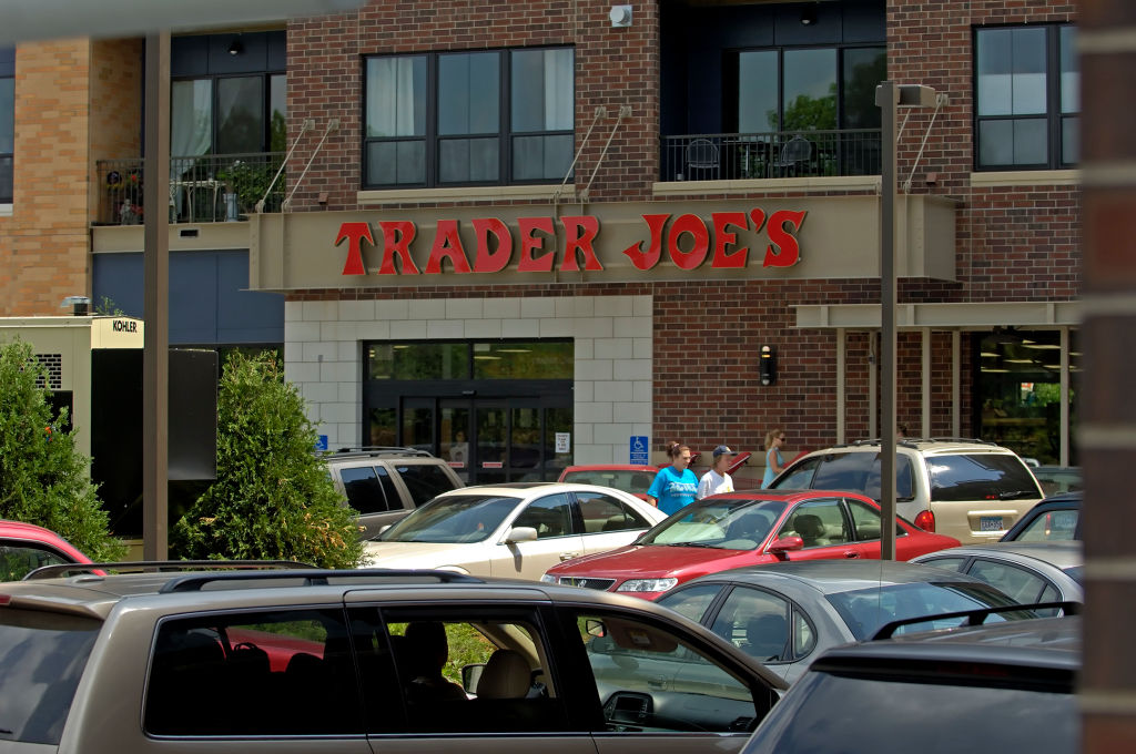DAVID BREWSTER ‚Ä¢ dbrewster@startribune.com St.LouisPark_Wednesday_7/5/06 - - - - - - - - - - The New Urbanism meets old problems. Trader Joe's rear parking lot has the same square-foot-in-the-store to parking-stall-in-the-lot ratio as your average s