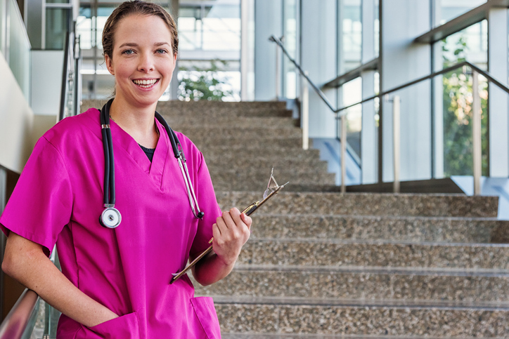 Young Friendly Nurse in Pink Scrubs