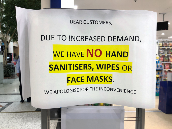 Sold out sign for hand sanitizer and face masks outside shop during coronavirus, COVID-19 pandemic