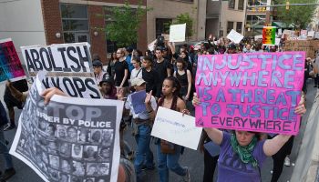 Tensions with Baltimore residents continue as protestors march in solidarity for Freddie Gray