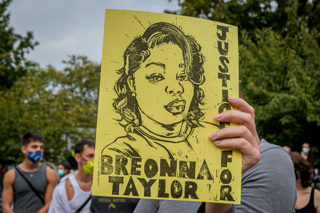 A participant holding a Justice For Breonna Taylor sign at...
