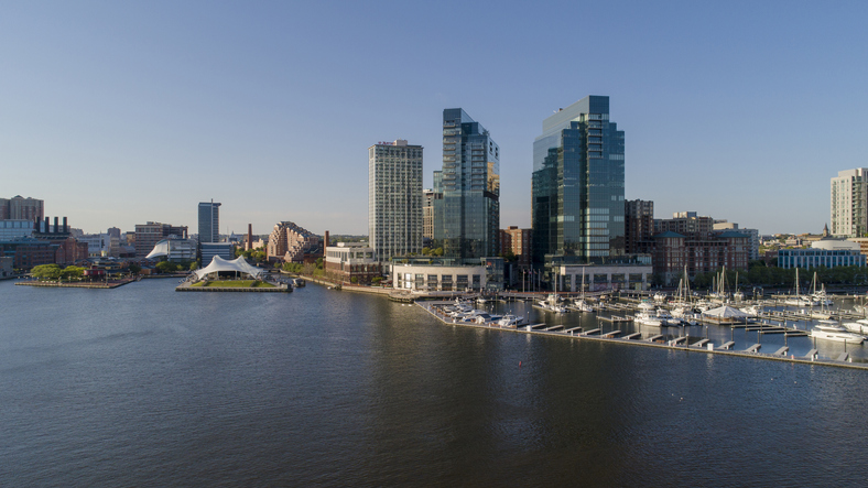 The aerial view on Inner Harbor and Harbor East district and marina at Patapsco River in Baltimore, Maryland, USA, at sunset.