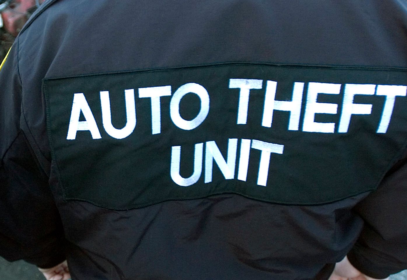 12/12/2007 Reading, PA 200702683Two Reading Police Officers with the Central Pennsylvania unit of the State Police Auto theft task force Wed afternoon next to a car at Vince's towing that had was stolen and stripped.Reading Eagle Photo