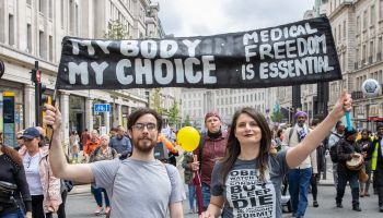 Anti lockdown and anti vaccine protestors march through London
