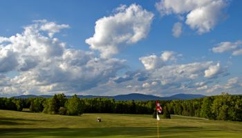 Mingo Springs Golf Course near Rangeley, Maine with golf cart in background