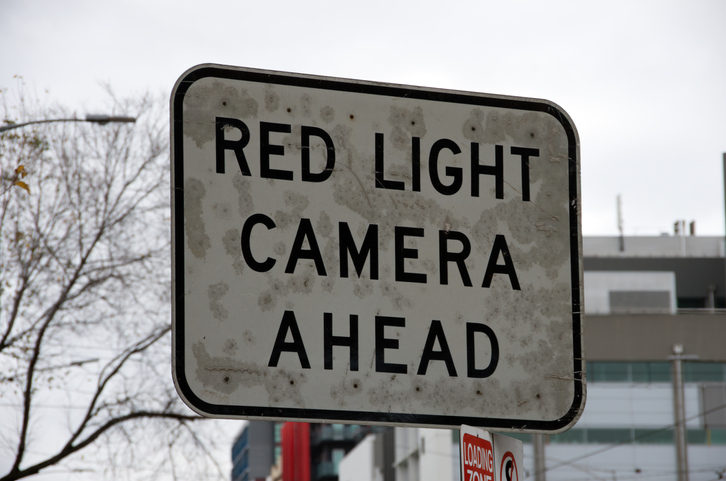 'Red light camera' traffic warning sign