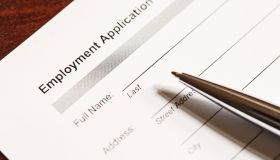 Job application form and pen
