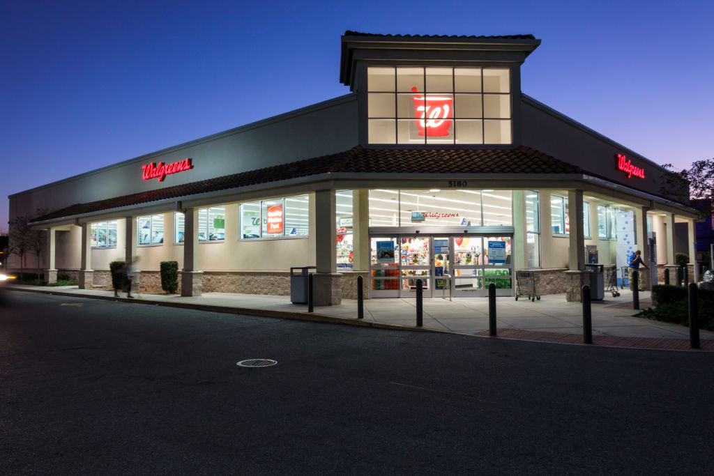 The entrance to Walgreens at night.