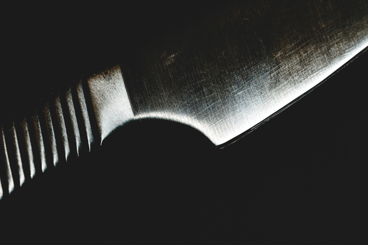 Steel kitchen knife on black background
