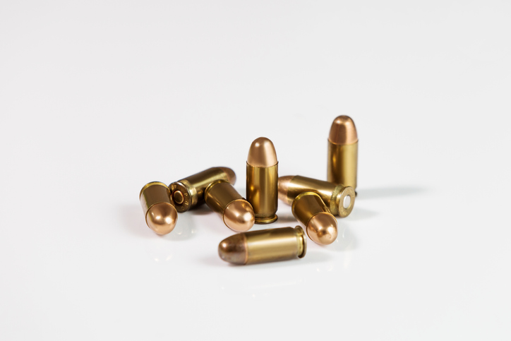 Close-Up Of Bullets Against White Background