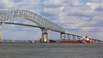 Tugs assisting tanker near Baltimore's Key Bridge