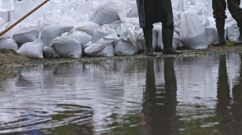 Sandbags and big bags placed to protect houses against water damage due to heavy rain and flood of the river