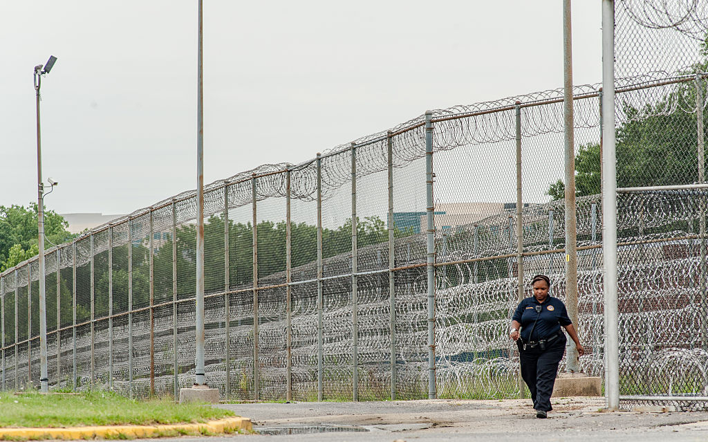 Stephen Moyer, Secretary of the Maryland Dept of Public Safety and Correctional Services, tours the Correctional Institution for Women with the warden, Margaret Chippendale.