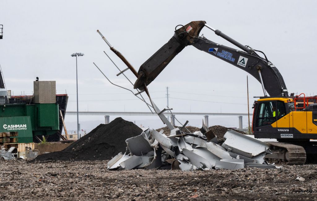 Workers cut up the remanants of the Francis Scott Key Bridge to prepare them to be recycled on April 12, 2024 a few weeks after the collapse. . The pieces are gathered from the water and taken to the port of Tradepoint Atlantic, which sits directly adjacen