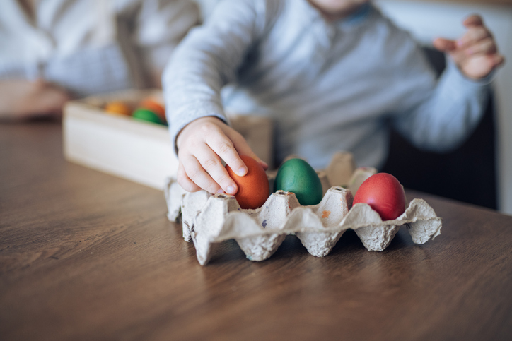 Mother and child celebrating Easter together at home.