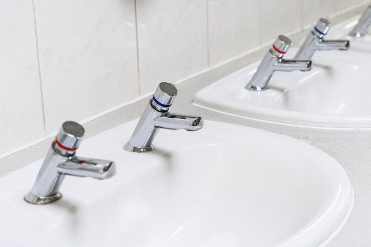 Separate Hot And Cold Water Taps In Public Bathroom