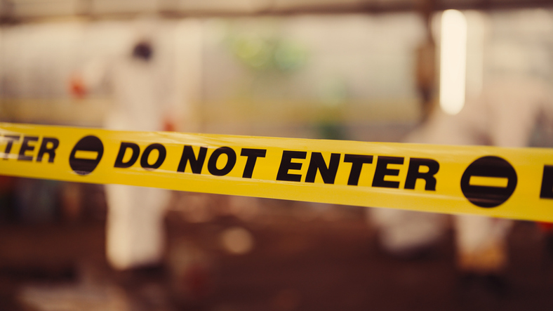 Ecologist collecting hazardous samples in contaminated area