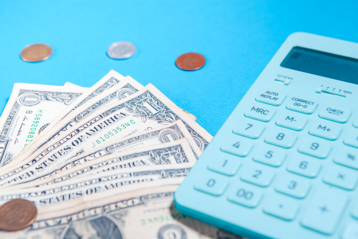 calculator and dollar bills on the table. business concept,