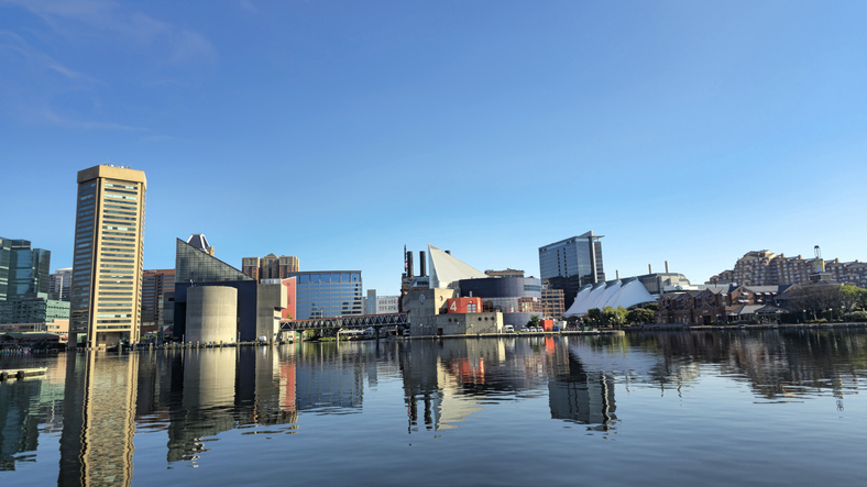 Panoramic view of Baltimore Inner Harbor skyline reflecting in water,United States,USA