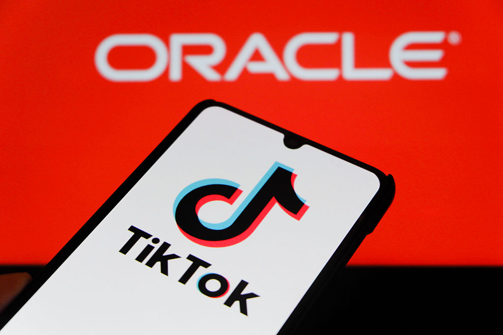 In this photo illustration, a TikTok logo is displayed on a...