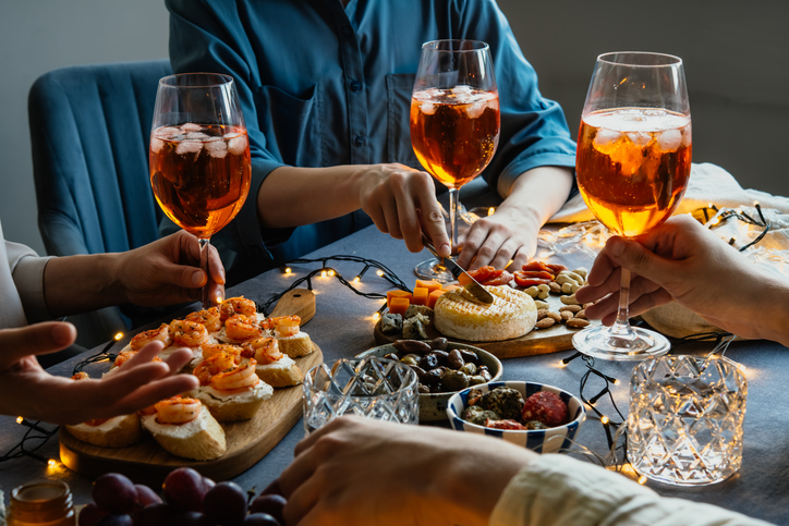 Glasses with aperol spritz seen during a friendly party of a celebration.